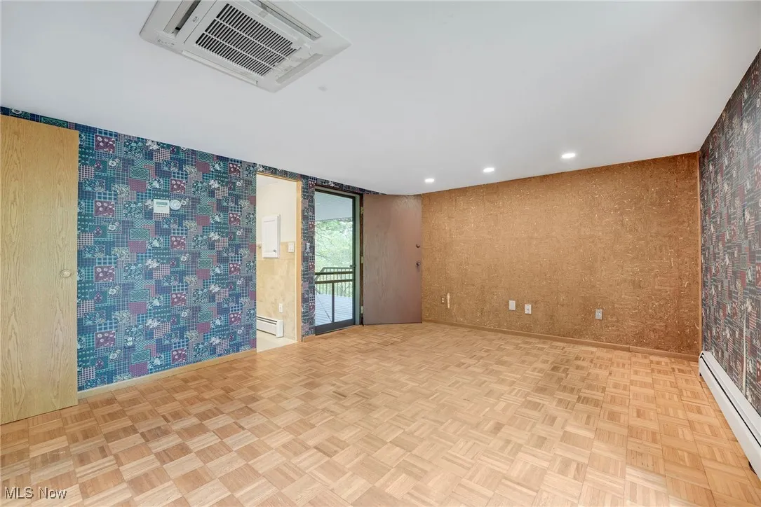 Primary suite has deck access and boasts two closets and an updated bath
