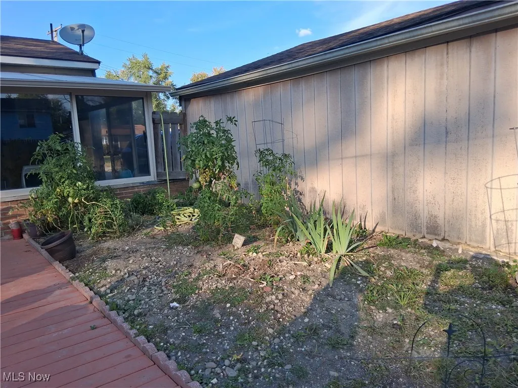 View of yard featuring a sunroom