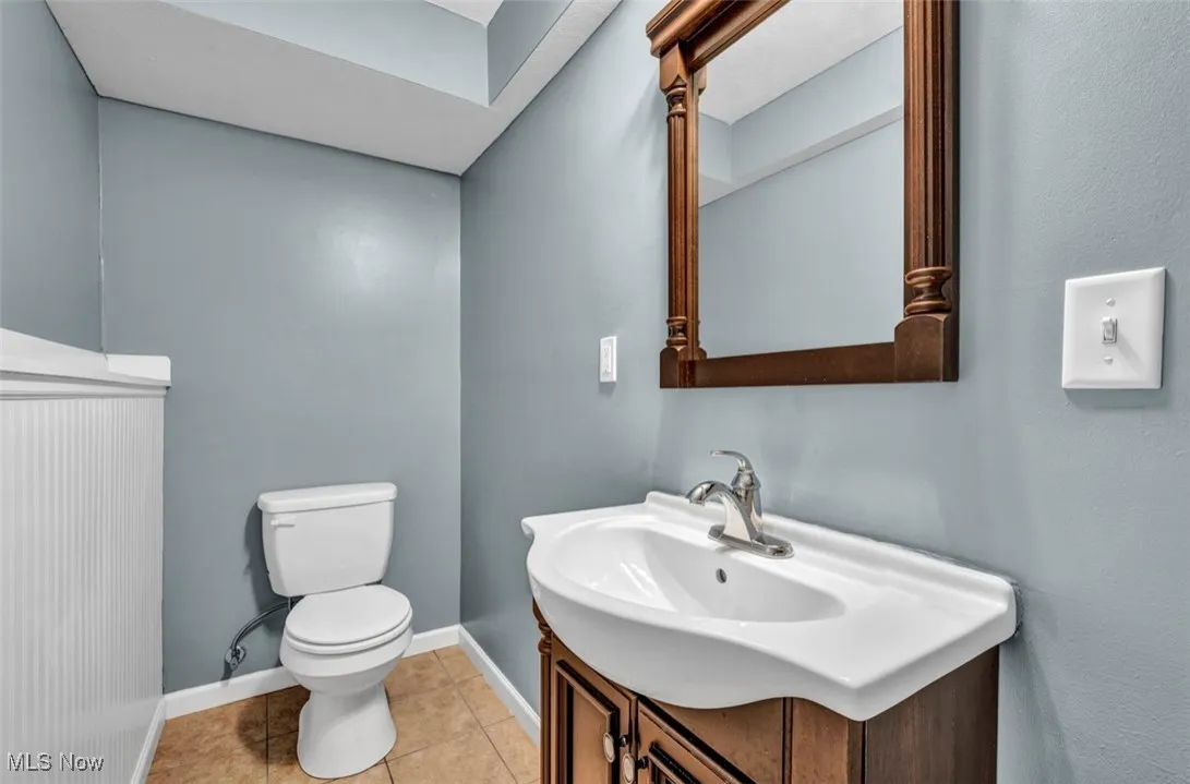 Bathroom with vanity and light tile patterned floors