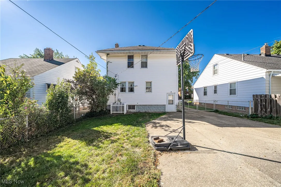 Rear view of property with a chimney