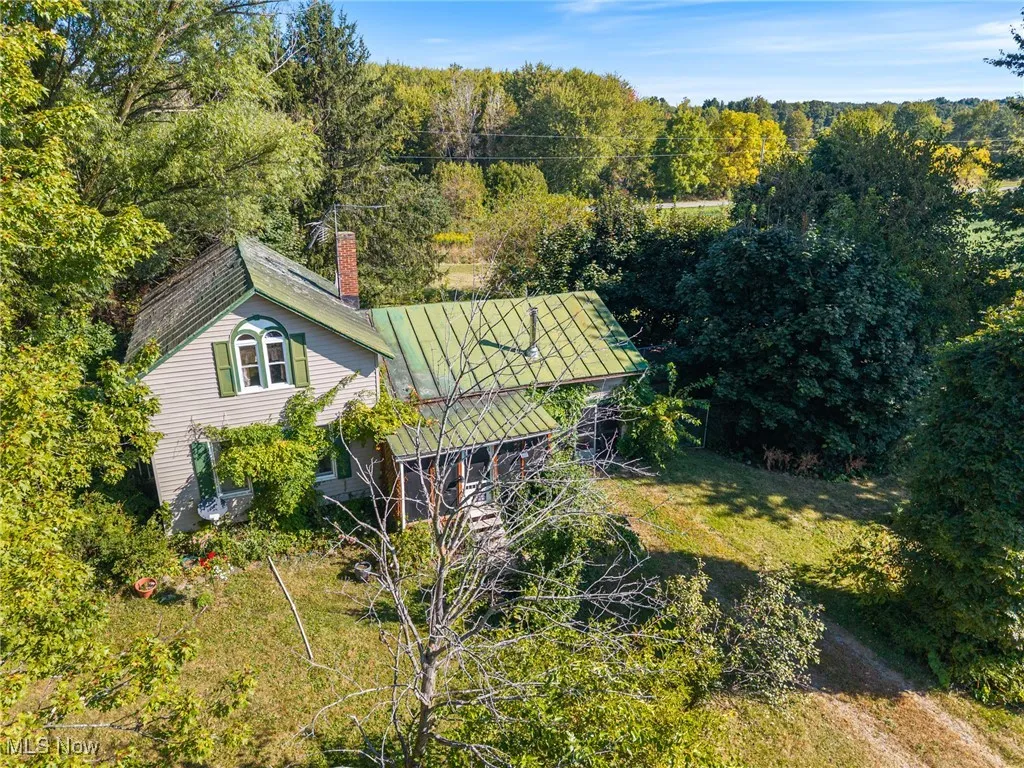 View from above of property with a heavily wooded area