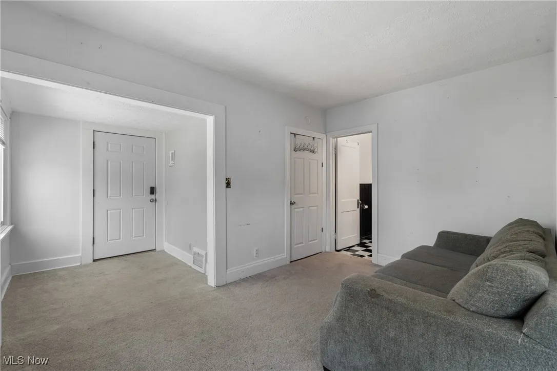 Sitting room with carpet flooring and baseboards