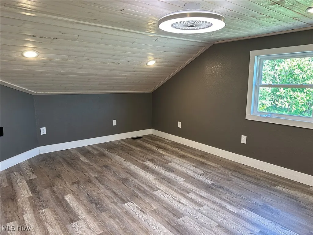 Bedroom 1with wooden ceiling, recessed lighting, lofted ceiling, and wood finished floors