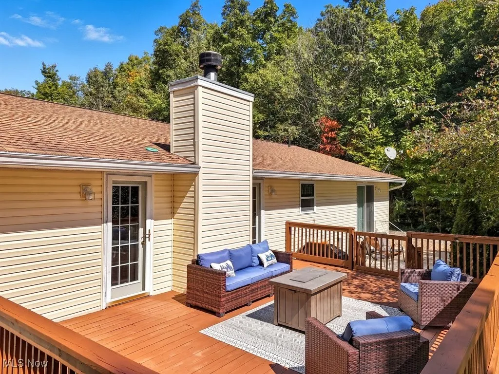 Wooden deck featuring an outdoor living space