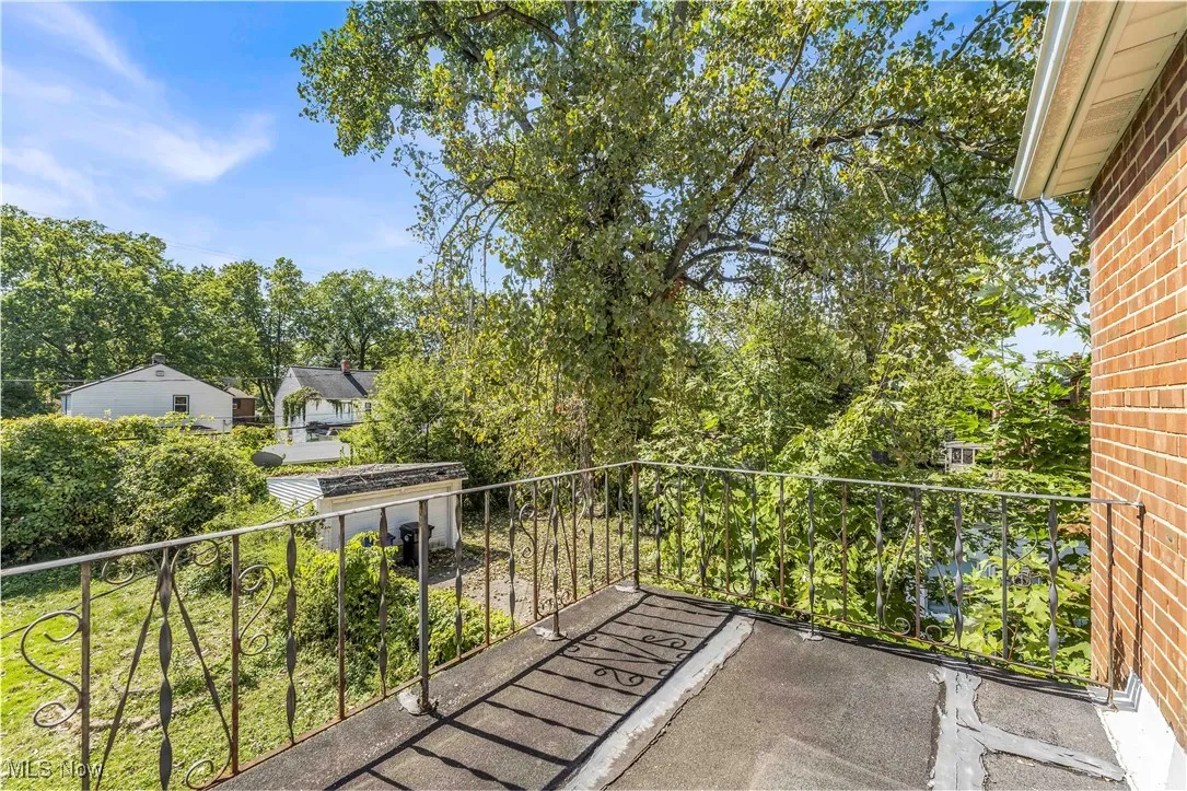 Balcony with view of scattered trees