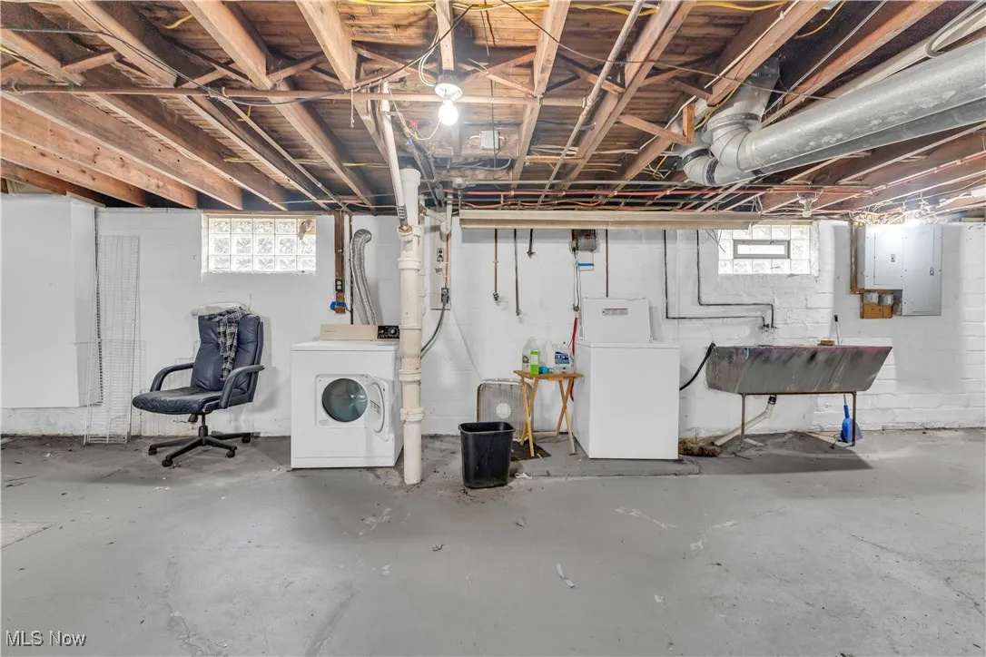 Basement featuring healthy amount of natural light and electric panel