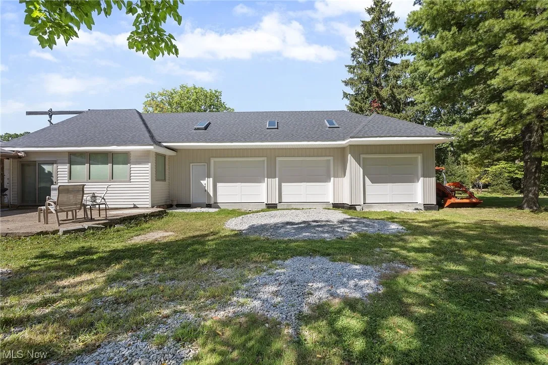 Huge Addition with Oversized 3 Car Garage with 40-' Floored Loft Attic with 5 Skylights