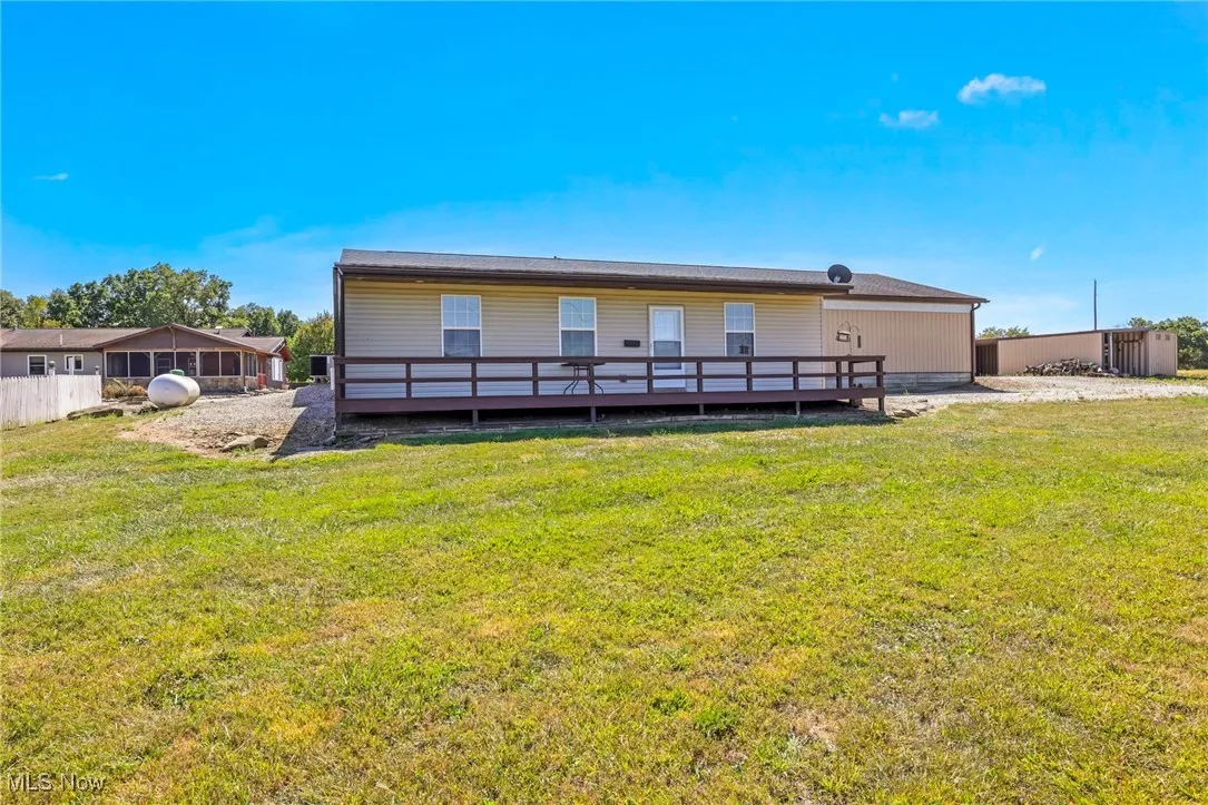 Rear view of house with a deck
