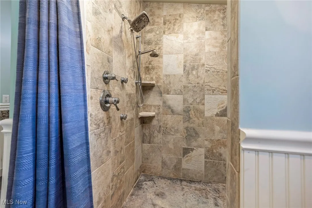 Bathroom with a tile shower