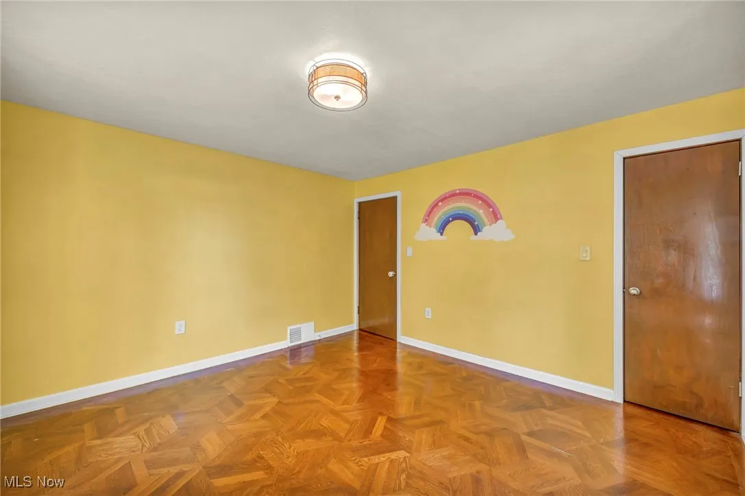 Unfurnished room featuring baseboards