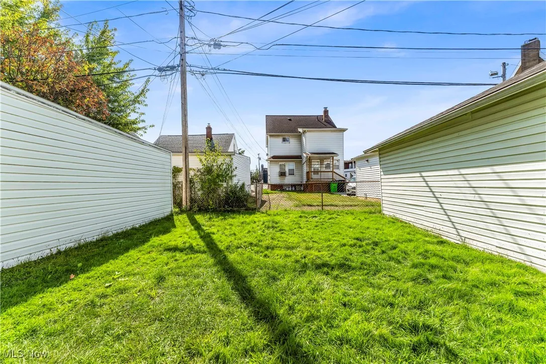 View of yard featuring a wooden deck