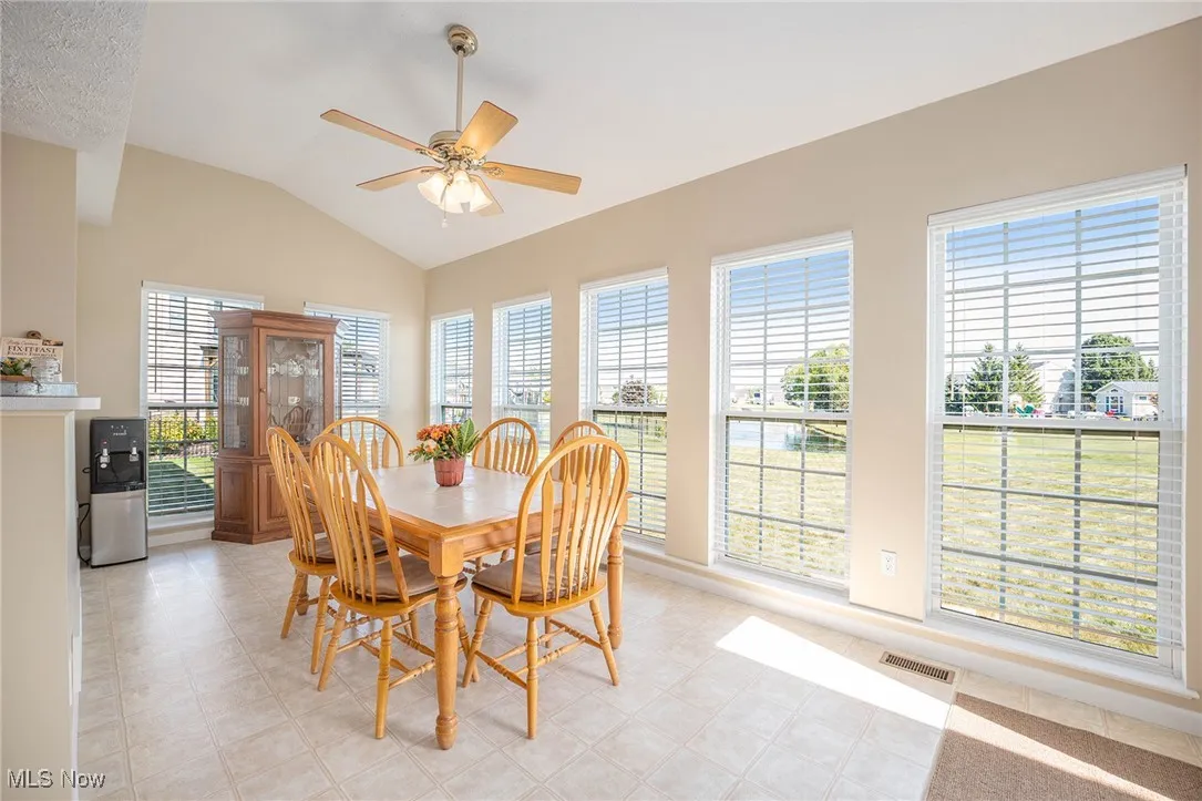Dining space with lofted ceiling and ceiling fan