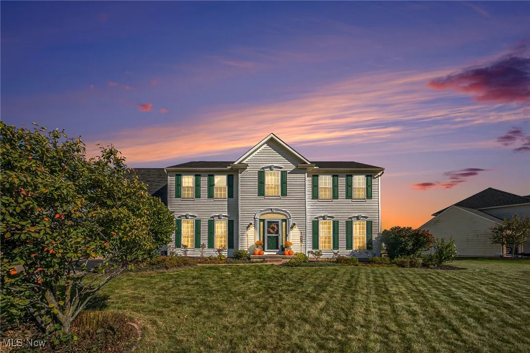 Colonial inspired home with a front lawn