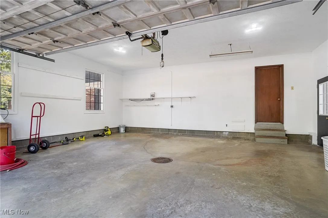 View of the attached 2-car garage with floor drain.