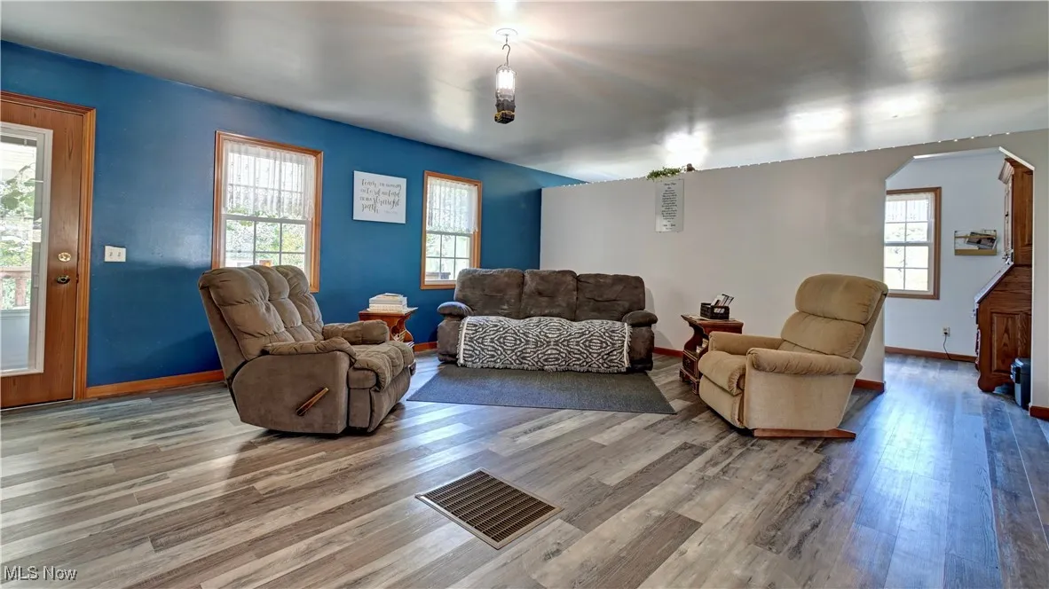 Living room with wood finished floors and baseboards