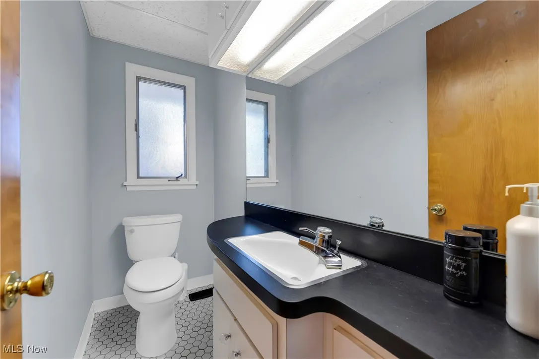 Bathroom featuring vanity and tile patterned floors