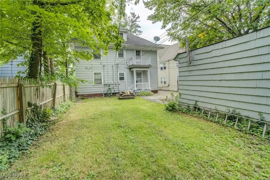Back of property featuring a fenced backyard