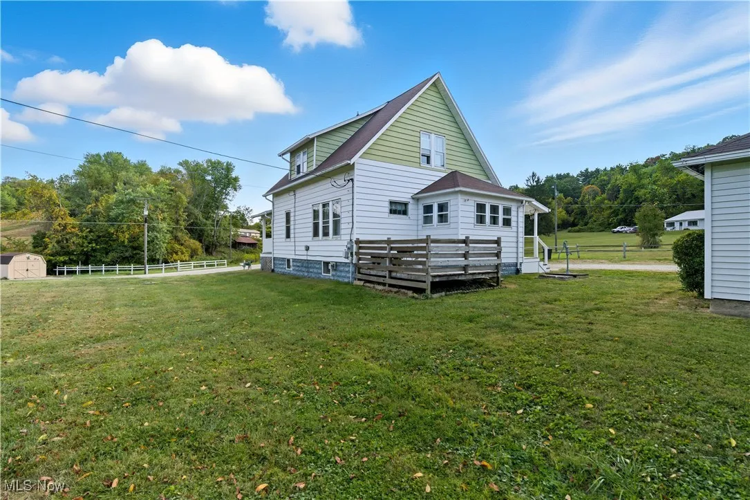 View of home's exterior featuring a shed