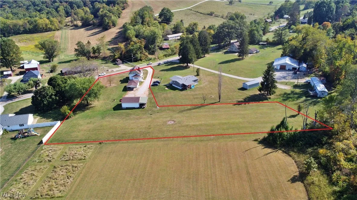 Aerial view of sparsely populated area featuring property boundaries highlighted