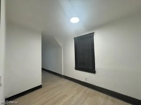  room with light wood finished floors and baseboards