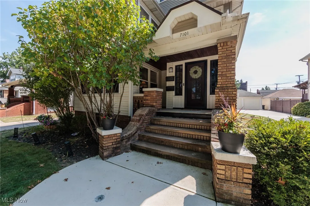 Doorway to property featuring a porch