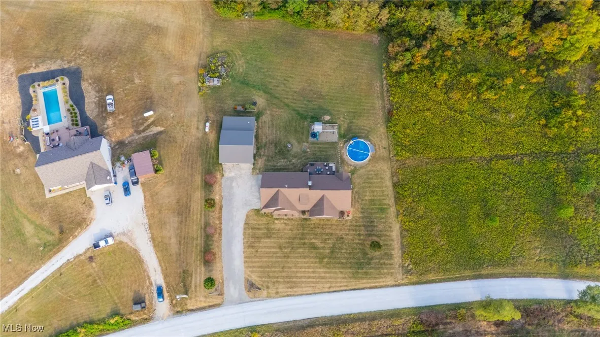 Aerial view of property's location featuring a pool