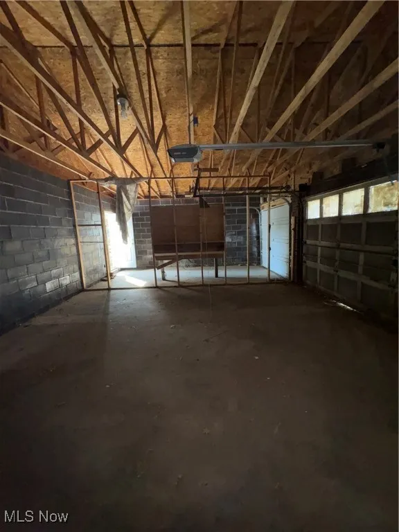 Garage featuring a garage door opener