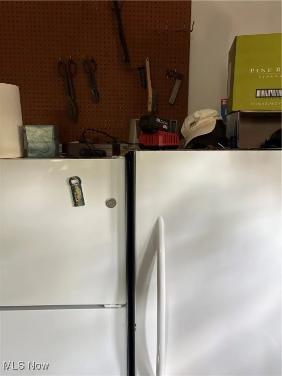 Kitchen view of freestanding refrigerator and refrigerator