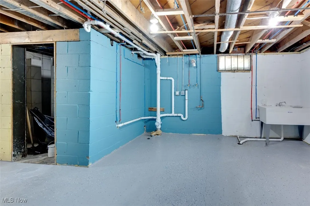 Unfinished basement featuring a sink