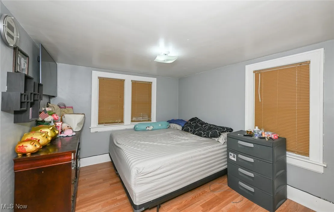 Bedroom with light wood-style floors
