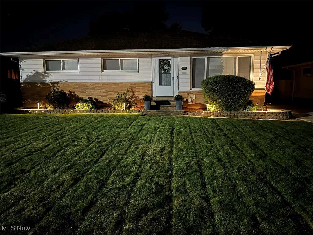 Welcome home to 7316 Oakwood Rd, featuring entry with low voltage landscape lighting