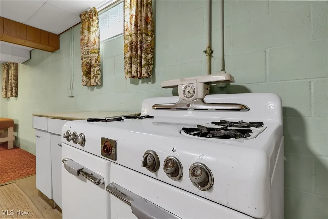 Basement kitchen stove conveys