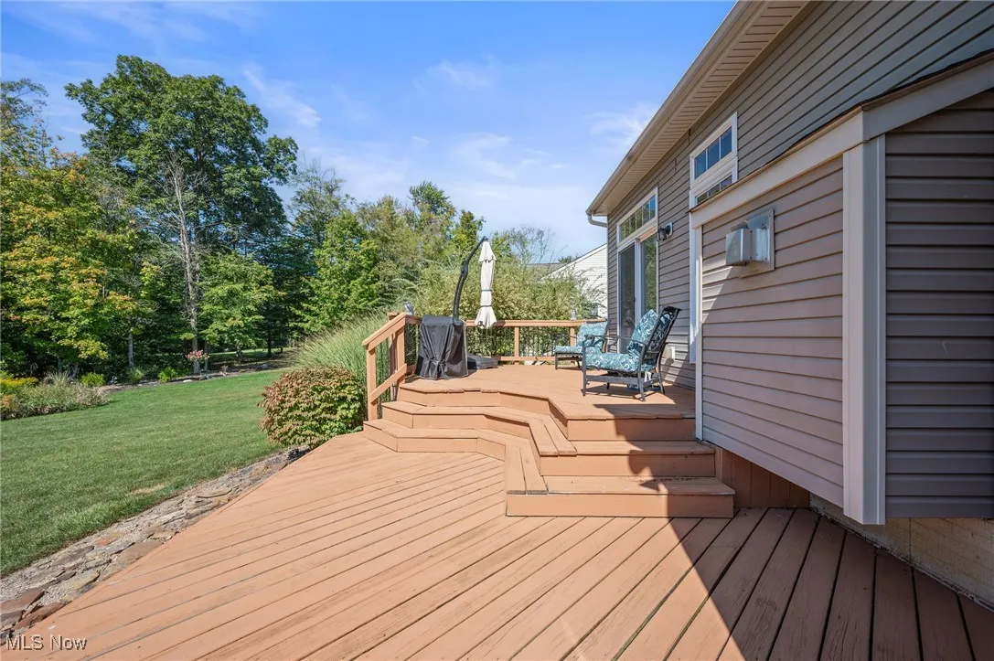 Wood deck leading from the dining area to the back yard