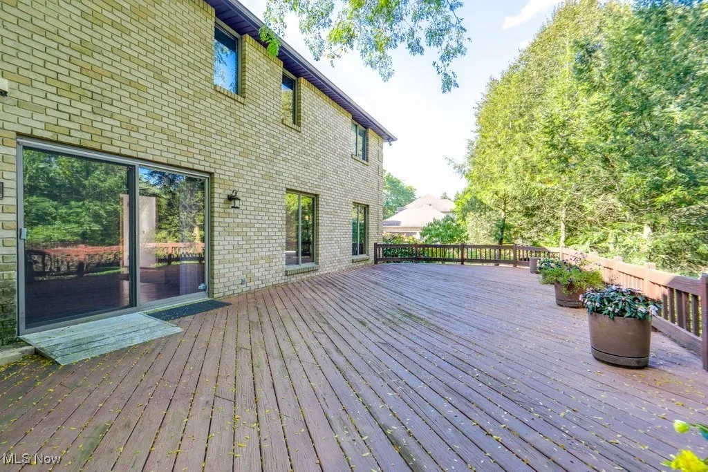 Large deck spanning the first floor with views of deck and yard from Kitchen, family room and office.