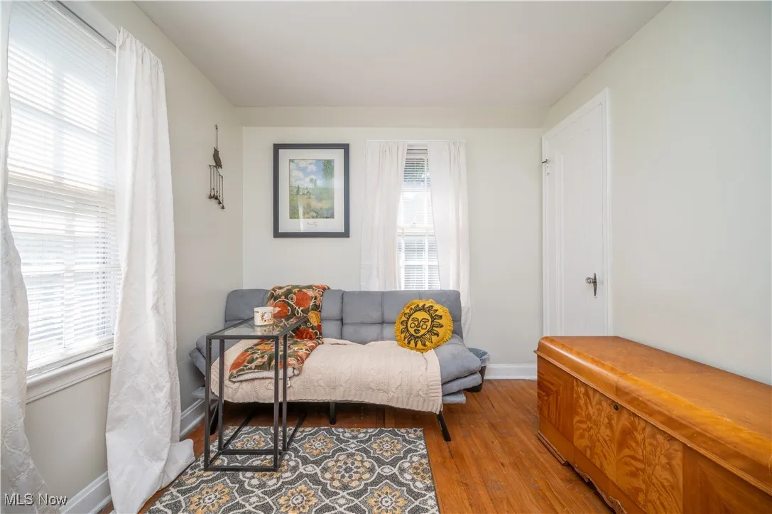 Bedroom featuring wood finished floors and baseboards