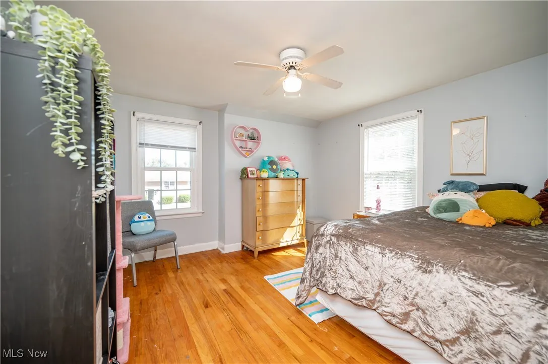Bedroom with wood-style flooring and ceiling fan
