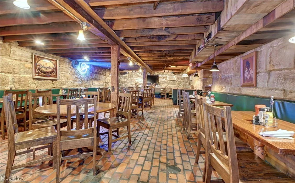 Dining room featuring brick floors