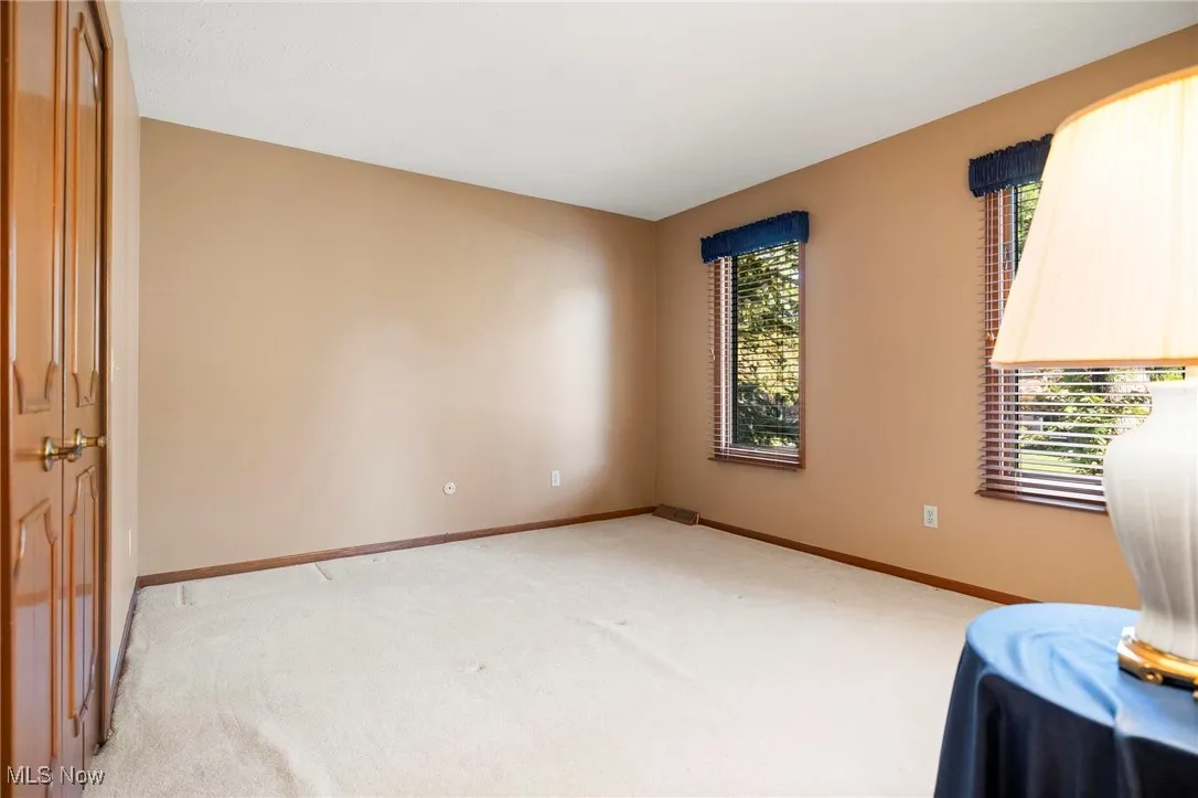 Unfurnished room featuring carpet flooring
