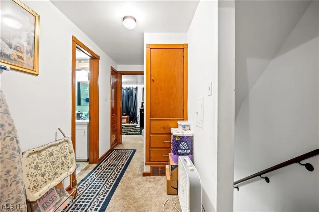 Hallway with light carpet