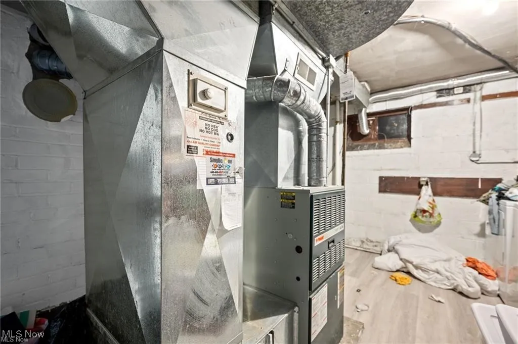 Utility room featuring heating unit