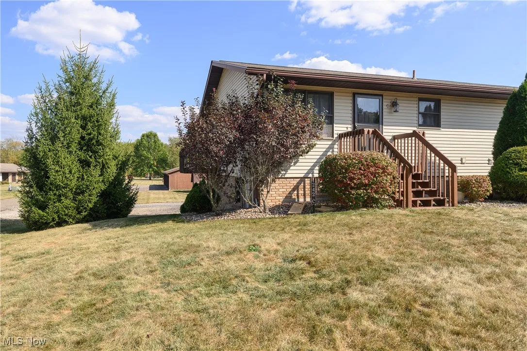 View of front of property with a front lawn