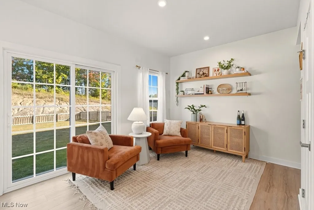 Sitting room featuring wood finished floors and recessed lighting