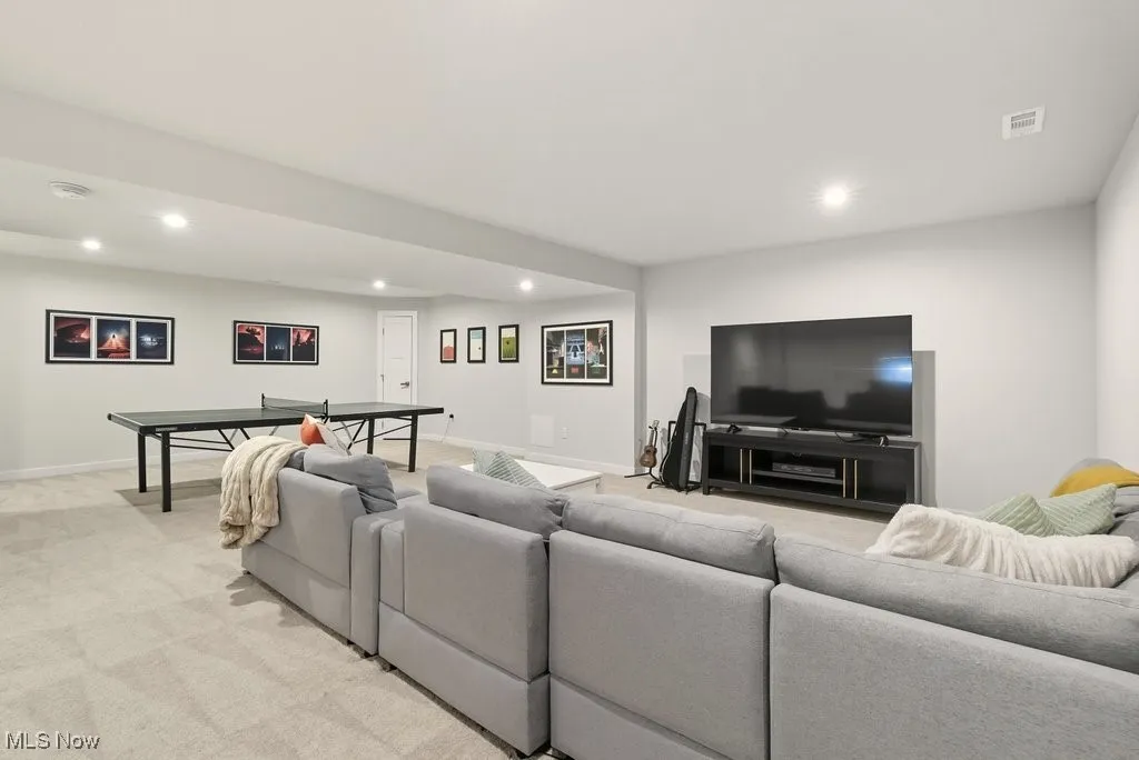 Living room featuring recessed lighting and light colored carpet