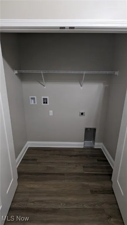 Laundry area with hookup for a washing machine, dark wood-type flooring, and electric dryer hookup