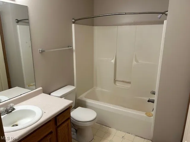 Full bath featuring bathtub / shower combination and vanity