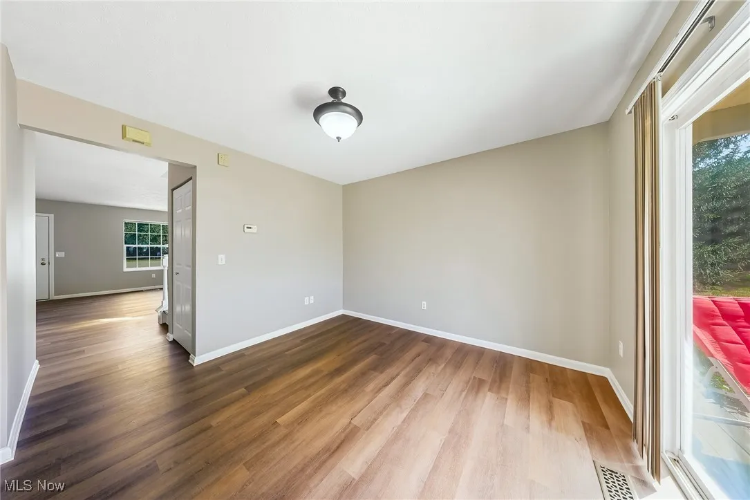 Spare room with light wood finished floors and baseboards