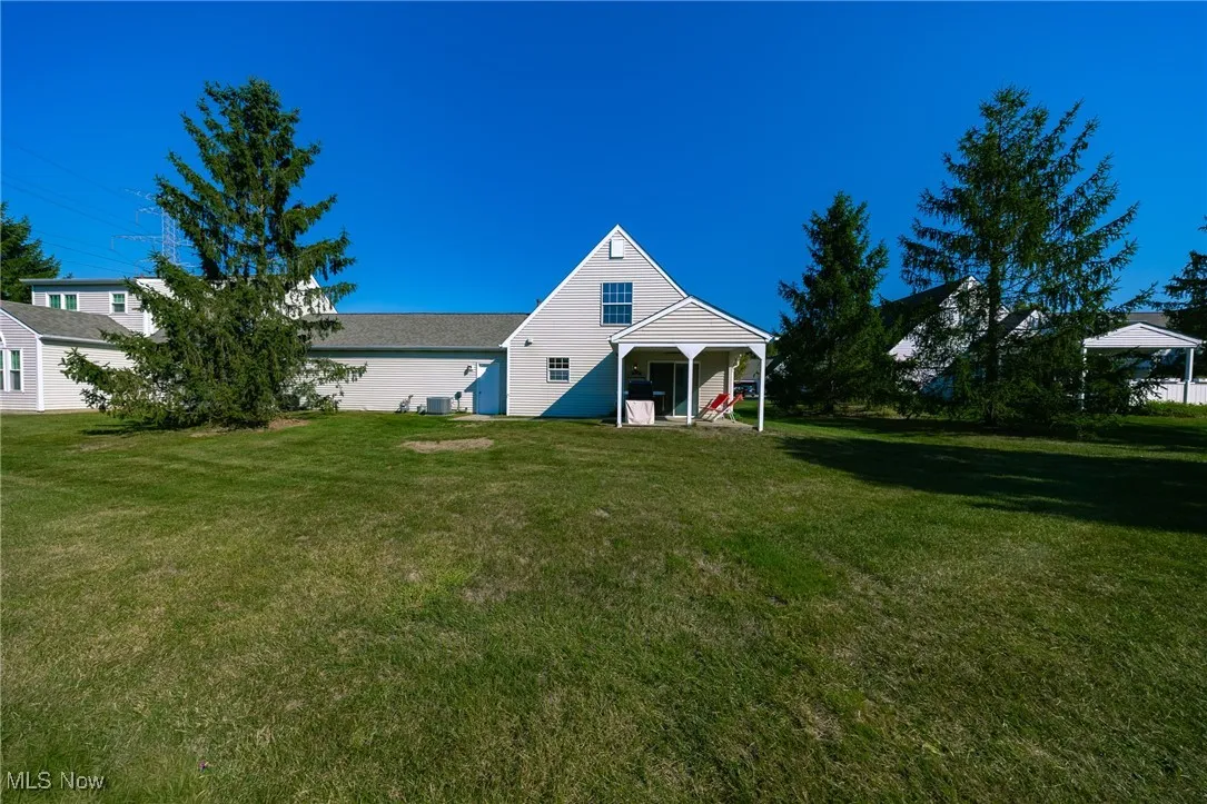 View of front of home featuring a front lawn and a patio area