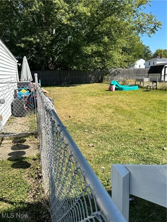 View of fenced backyard