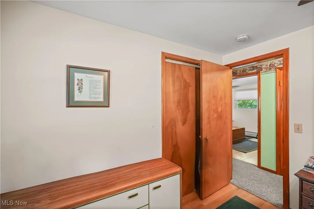 Mudroom with light wood-style flooring
