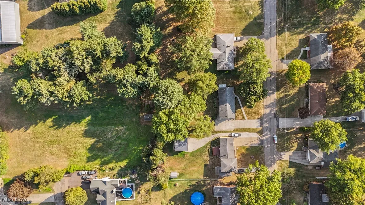Aerial view of property's location featuring nearby suburban area